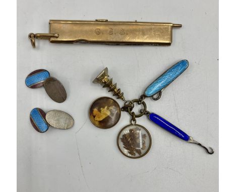 An unmarked yellow metal propelling pencil/ruler and pen knife by JC Vickers Regent St. Together with a pair of guilloche ena