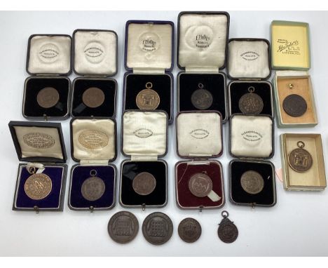 A collection of bronze athletics medals 1920/30s to KW Hancock. 