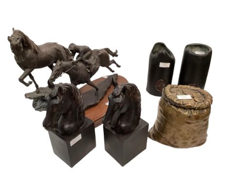 A C19th French bronze tobacco jar in the form of a sack of coins; a resin horse head book ends, a resin model of a jockey and