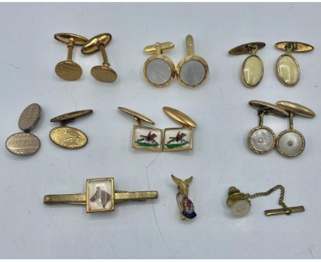 A pair of reverse  painted cufflinks with rider and horse together with a matching tie pin and a collection of yellow metal g
