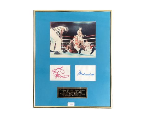 Muhammed Ali and George Foreman signed autographs with Boxing Photo 'Rumble in the Jungle' In glazed frame with plaque. Provi
