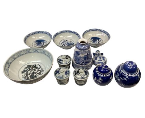 A collection of modern Oriental style blue and white ceramic items to include bowls, ginger jars a small moon vase etc. 
