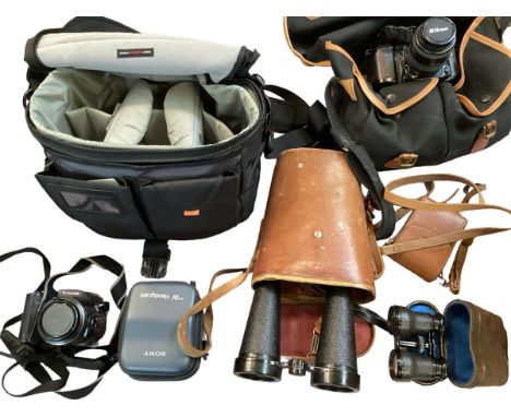 A quantity of vintage cameras and binocular in leather case 