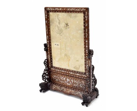 Good Chinese hardwood screen, the silk panel worked with dragons and sea creatures amidst scrolling foliage, contained within