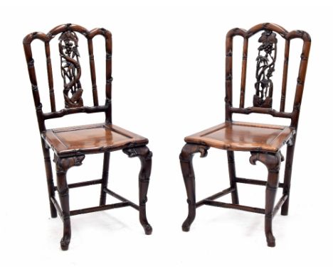 Good pair of 19th century Chinese hardwood carved chairs, with pierced foliate and floral carved vertical central splats flan