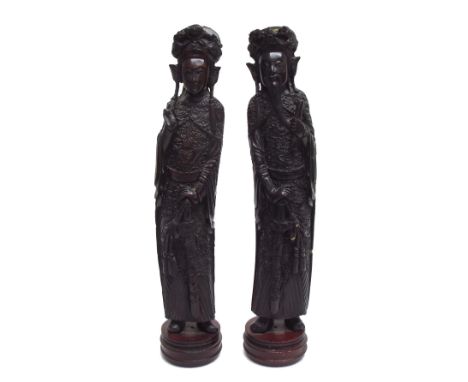 Pair of Chinese reproduction faux hardwood resin figures, mounted upon circular hardwood bases, 17.5" high-** Provenance - Fr