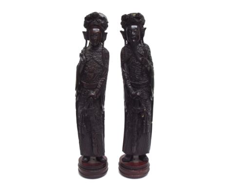 Pair of Chinese reproduction faux hardwood resin figures, mounted upon circular hardwood bases, 17.5" high-** Provenance - Fr