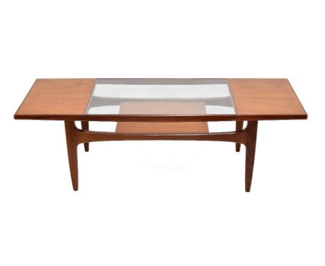 G Plan teak 'Long John' coffee table, with glazed inset panel and magazine shelf undertier, 54" wide, 20" deep, 17" high