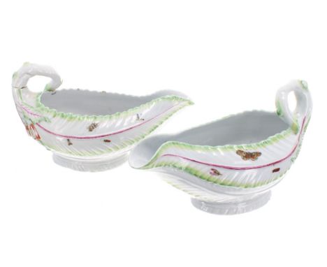 Pair of Worcester lettuce leaf porcelain sauce boats, decorated with moulded leaf texture and naturalistic handles, green and