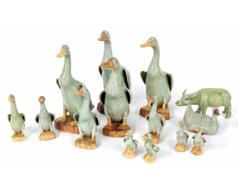 Collection of twelve graduated Chinese porcelain celadon ducks, 20th century, some with impressed marks underside, tallest 9"