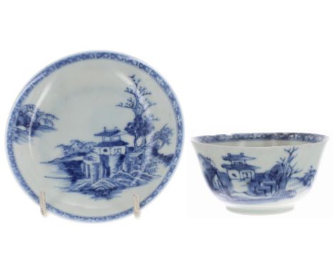 Chinese Nanking Cargo blue and white porcelain tea bowl and saucer, decorated with a pagoda landscape, the saucer 4.5" diamet