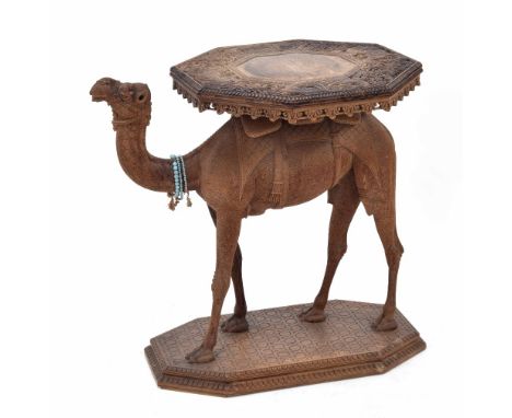 Eastern 19th century novelty carved hardwood camel side table, the octagonal top carved with dragons amidst scrolling foliage