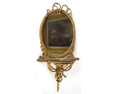 Circa 1800 Regency giltwood gesso oval wall mirror, the rope twist and tassle moulded frame and glass of heavy patina, over a