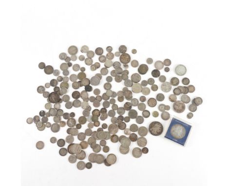 A LARGE QUANTITY OF MOSTLY SILVER COINS OF THE WORLDTo include silver and base metal, two restruck Maria Theresia dollars, a 