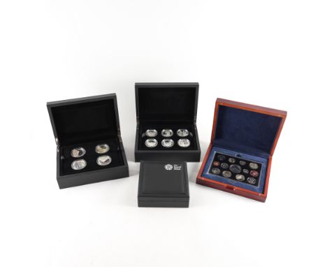 FOUR ROYAL MINT COMMEMORATIVE COIN SETSComprising; A Portrait of Britain Five Pounds Silver Four Coin Set, a 2006 thirteen co
