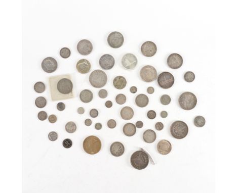 A GROUP OF MOSTLY SILVER FOREIGN COINSTo include a Prussia one thaler 1818 A, further German issues, a Netherlands two and a 