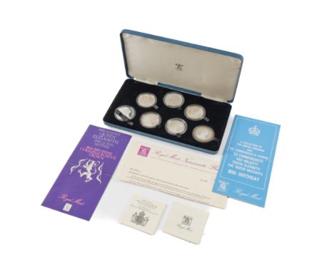 A SET OF SEVEN SILVER PROOF CROWN SIZED COINSCommemorating The 80th Birthday of Her Majesty Queen Elizabeth, The Queen Mother
