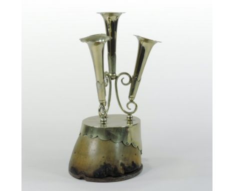 An early 20th century silver plated epergne, with three trumpet shaped vases, mounted on a horse's hoof, 29cm tall