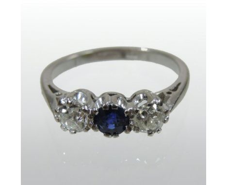 An 18 carat white gold sapphire and diamond three stone ring