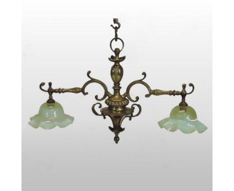 An Art Nouveau brass twin branch ceiling light, with opaline glass shades, 76cm