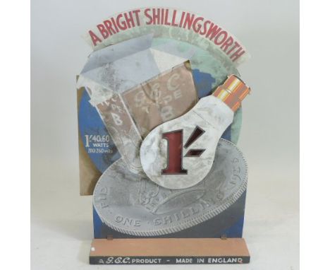 A 1930's G.E.C. illuminated cardboard shop advertising display board, inscribed A Bright Shillingsworth, bearing a label to t