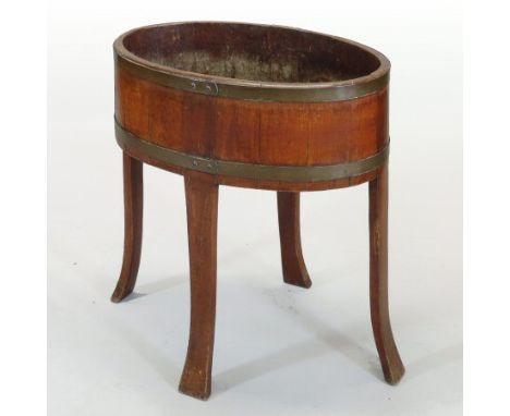 A 19th century coopered light oak and brass bound wine cooler, on a splayed base, stamped indistinctly to the underside, with