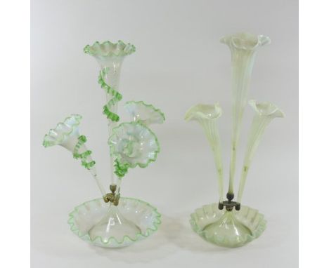 A Victorian glass epergne, having four clear and green glass trumpet shaped vases, with trailed decoration, on a frilled base