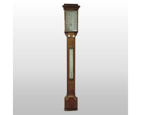 An early 20th century oak cased stick barometer and thermometer, bearing a label for T B Winter and Son, 100cm high