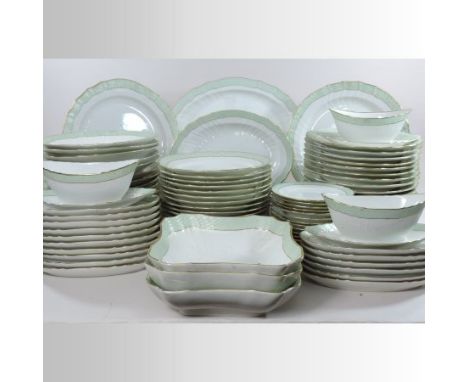 An extensive Royal Copenhagen porcelain dinner service, decorated with a gilt and green basket weave border, eighty-seven pie
