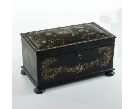 A 19th century black papier mache and inlaid tea caddy, of slightly domed rectangular shape, the hinged lid inlaid with mothe