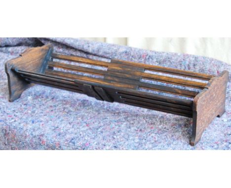 Early 20th century adjustable book trough, 57cm extended and 37cm closed.