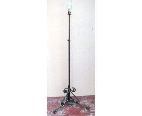Wrought iron tripod standard lamp, 195cm high.