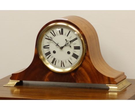 Late 20th century figured mahogany dome top mantel clock, brass finish bracket feet, twin train movement striking the hours a
