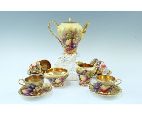 An Aynsley Orchard Gold coffee set, comprising six cups and saucers, a coffee pot, a cream jug, and a sugar basin, decorated 