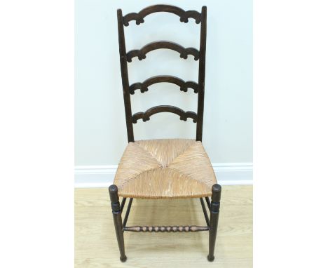 An early 20th Century rush seated ladder back chair