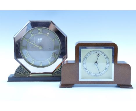 A 1960s brass and mirrored mantle clock, keyless wind and set movement, case formed as an octagonal bevelled mirror having an