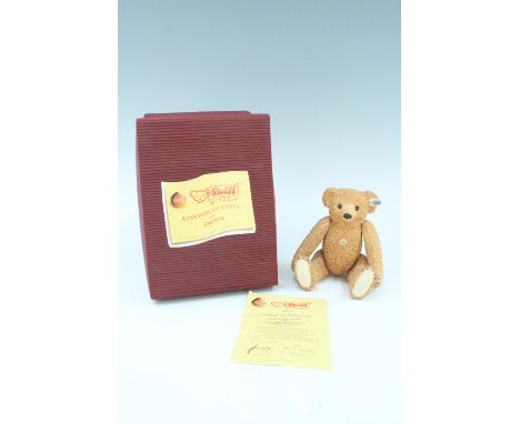 A boxed Steiff "100th Anniversary Bear" from Enesco, having articulated limbs, 14 cm sitting