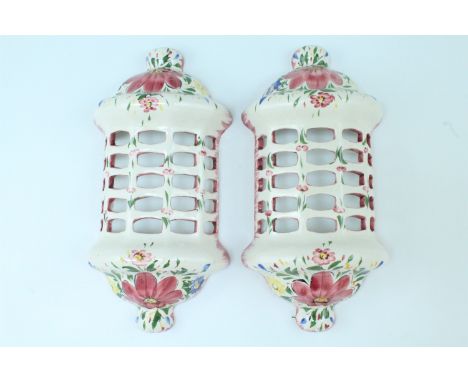 A pair of modern floral decorated faience wall light covers, 17 x 8 x 34 cm