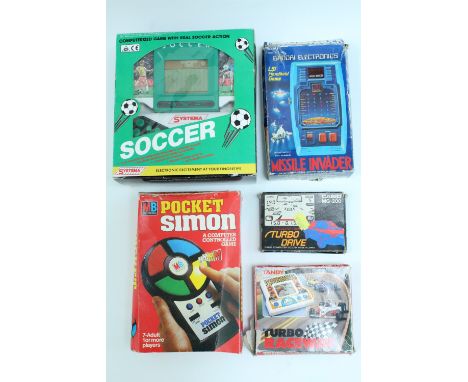 Sundry vintage hand-held electronic games / video games, including Pocket Simon, a Casio MG-200 "Turbo Drive", Missile Invade