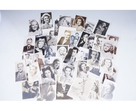 A quantity of promotional portrait photographs and postcards of screen and stage stars, circa 1930s - 1940s, many bearing fac