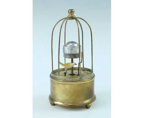 A late 20th Century brass automaton alarm clock, the keyless movement having an orbital dial with a pointer and a ticking bir