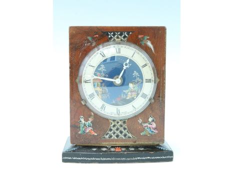 A 1950s Chinoiserie walnut mantle clock, having a Smiths movement, a painted and gilt dial with a Roman numeral chapter ring,