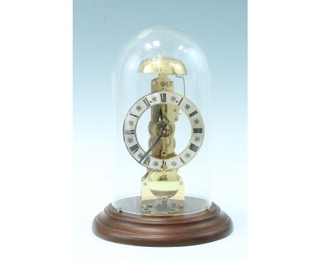 A modern German skeleton clock, anchor escapement, striking on a bell, under a glass dome, 28.5 cm, (running when catalogued,