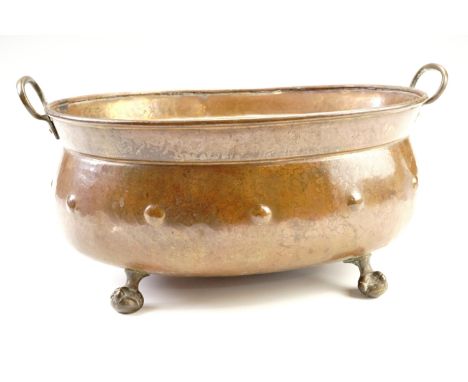 An early to mid 20th Century planished copper planter, 38 cm x 26 cm x 16 cm