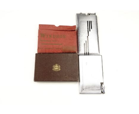 A group of vintage combination cigarette case and lighters, comprising a boxed Windsor example, a cased and one other Evans a