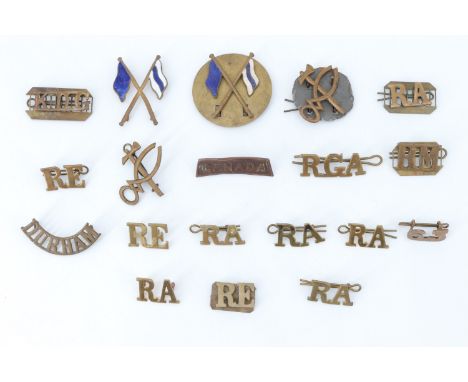 A small group of British and Canadian army metal shoulder titles and qualification badges