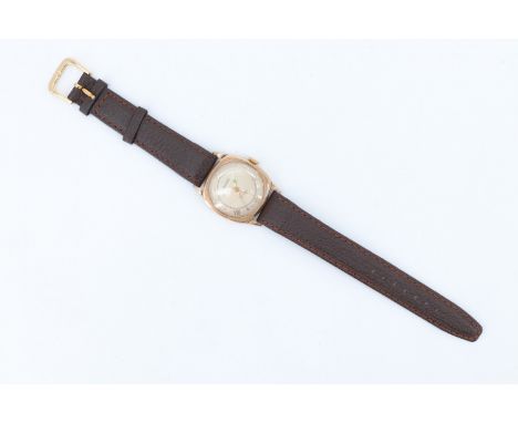 A 1950s Rotary 9 ct gold gentleman's wristwatch, having a 17 jewel Swiss movement, a silvered dial with mixed Roman numerals,
