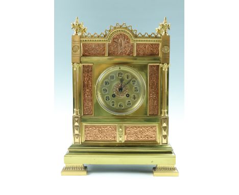 An imposing Victorian brass mantle clock, having a French drum movement striking on a gong, the Arabic dial having a centre s