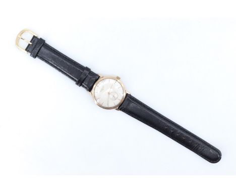 A 1950s Longines 9 ct gold gentleman's wristwatch, having a 17 jewel Swiss movement No. 10482652, a silver dial with gold bat