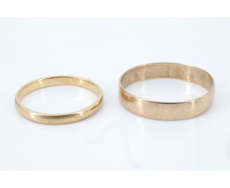 An 18 ct gold wedding band and a 9 ct gold wedding band, size L, 1.55 g, and size R, 1.40 g, respectively